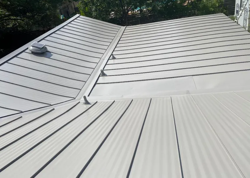 Solar attic fan installed on a metal roof for Roof Ventilation in Anderson Creek